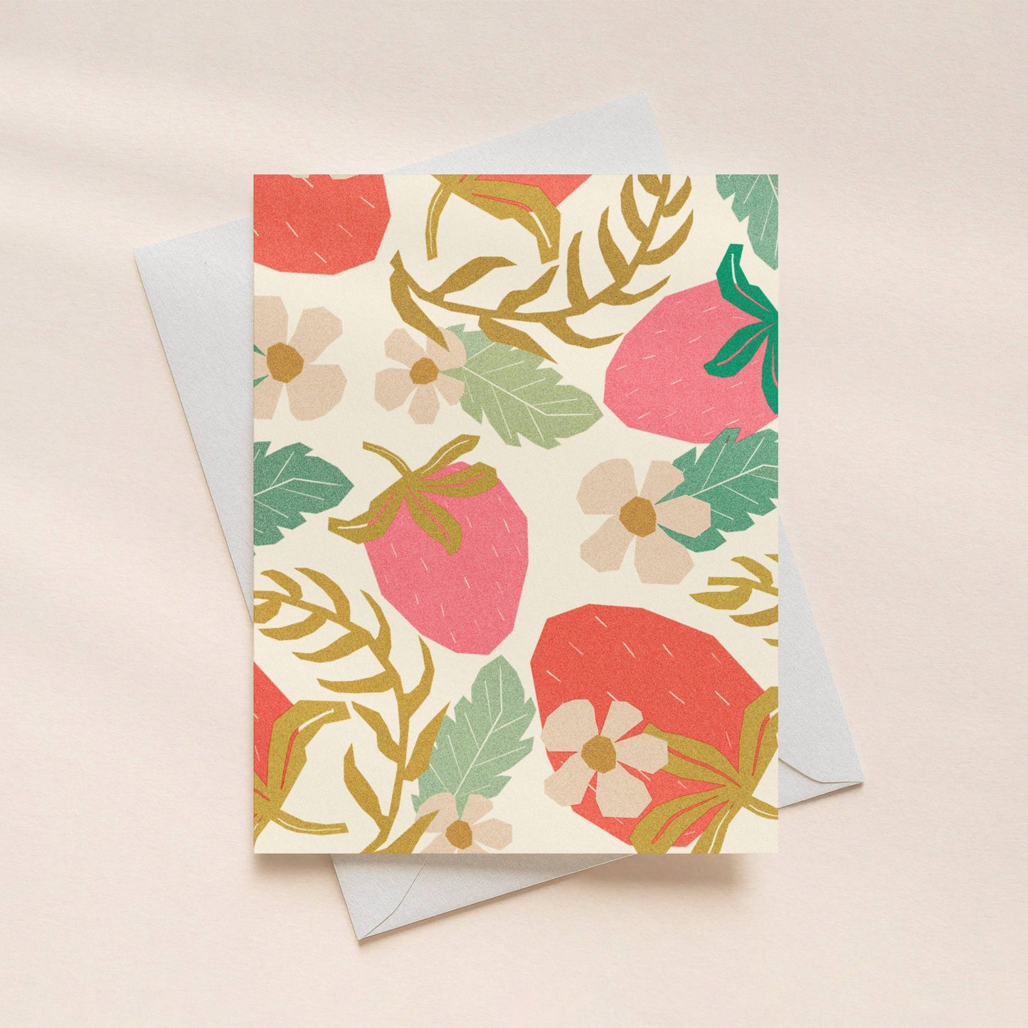 Floral patterned card with a matching envelope on a light pink background
