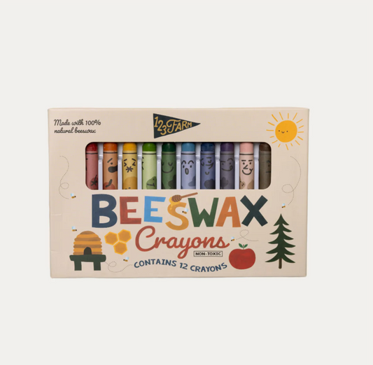Box of beeswax crayons with colorful illustrations on a white background