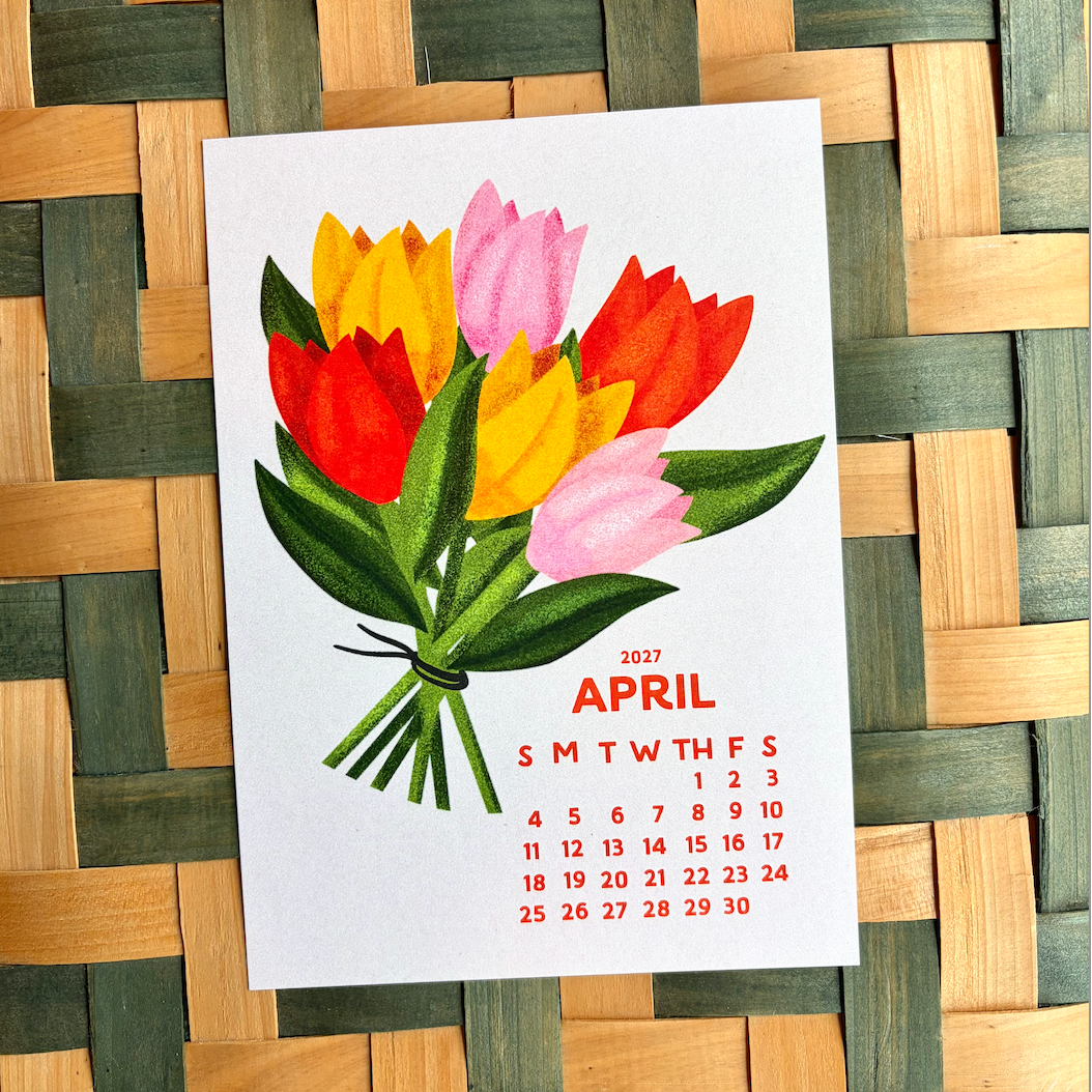 April 2027 calendar with tulip design on a woven mat background