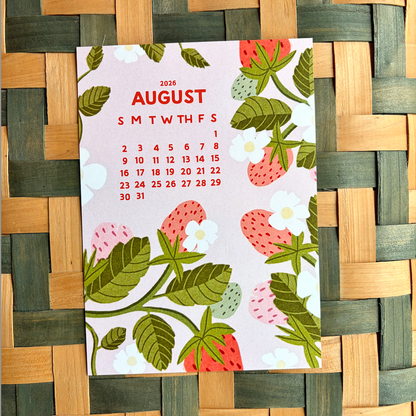 Calendar for August 2026 with strawberry design on a woven mat background