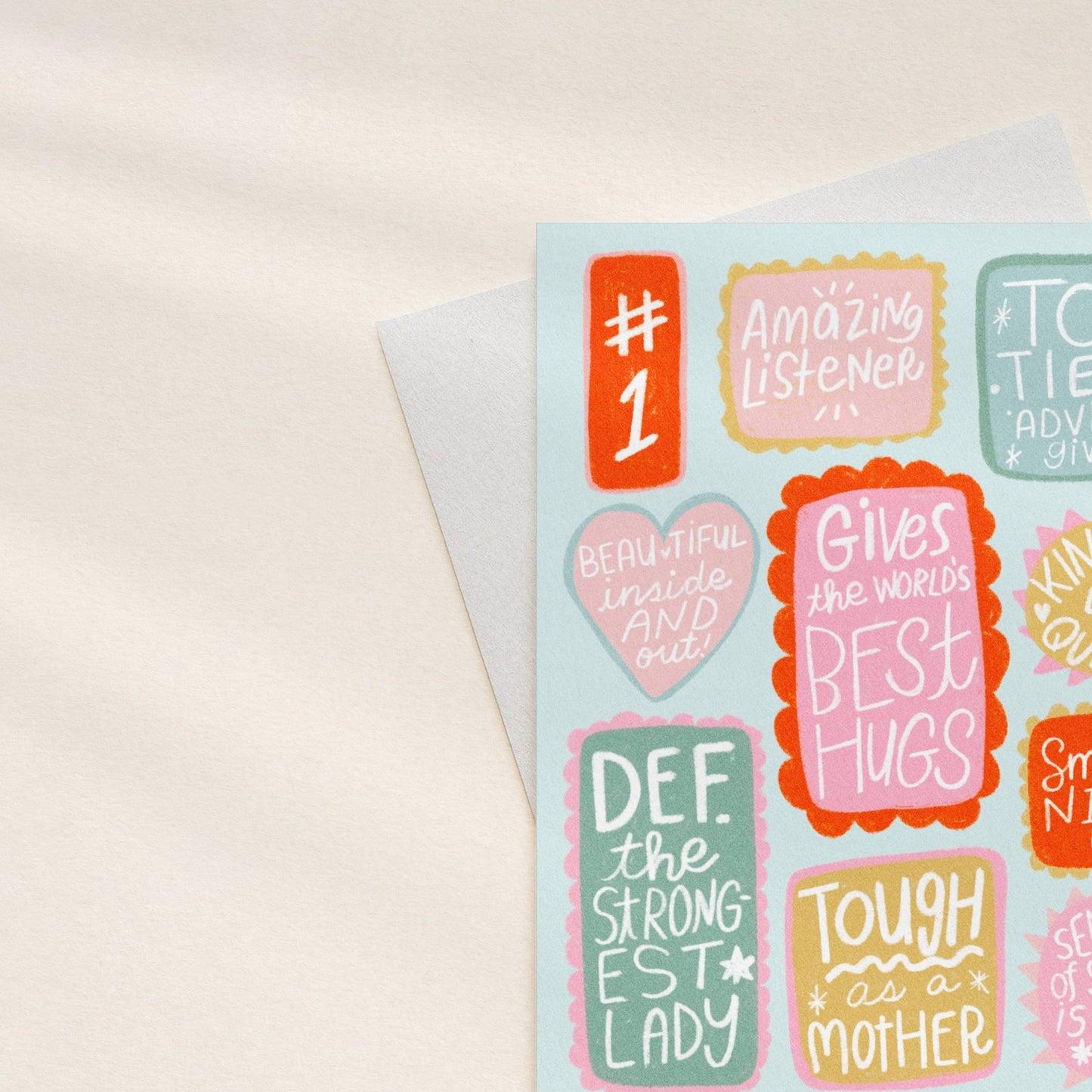 Sheet of colorful stickers with motivational phrases on a light background