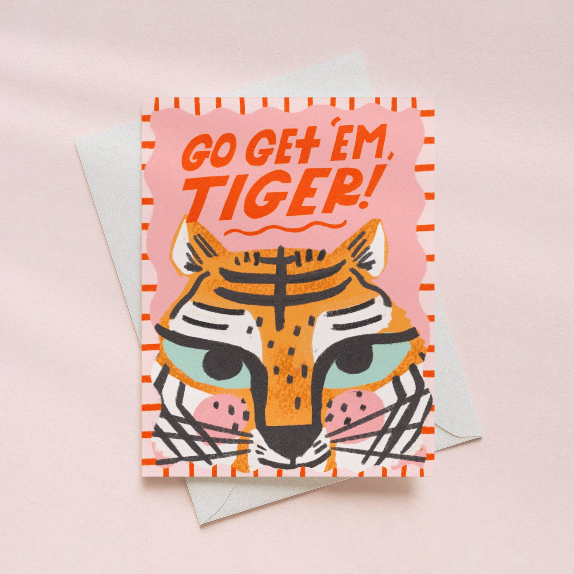 Greeting card with tiger illustration and 'Go Get 'em, Tiger!' text on a pink background