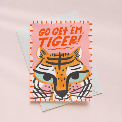 Greeting card with tiger illustration and 'Go Get 'em, Tiger!' text on a pink background