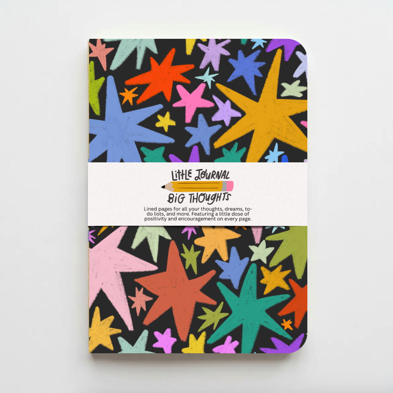 Colorful star-patterned notebook with 'Little Journal Big Thoughts' text on a white background