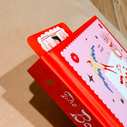 A red hardcover book titled 'The Book of.