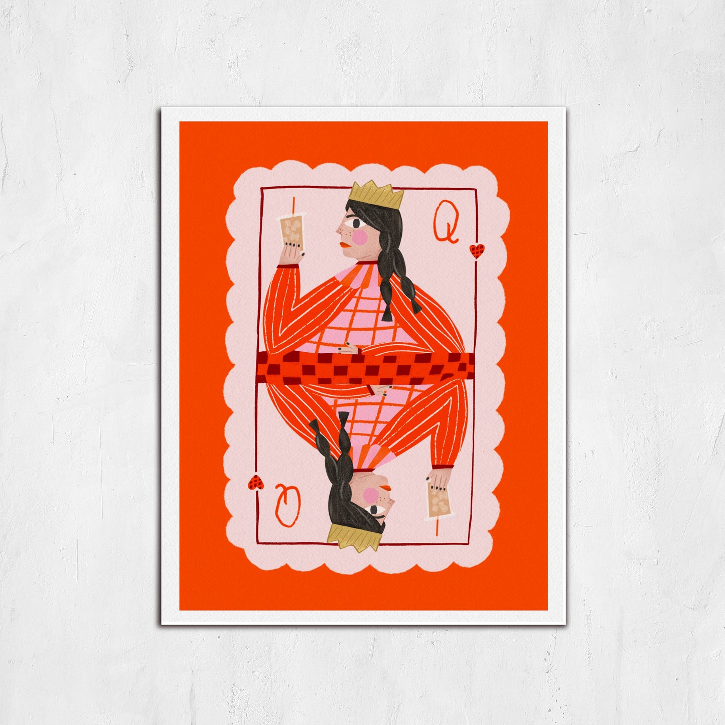 Framed artwork of a stylized card with a person on an orange background