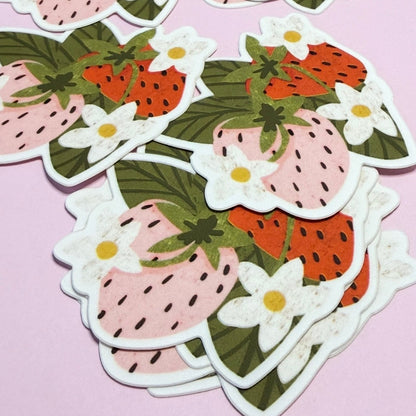 Strawberry-themed stickers with flowers on a pink background