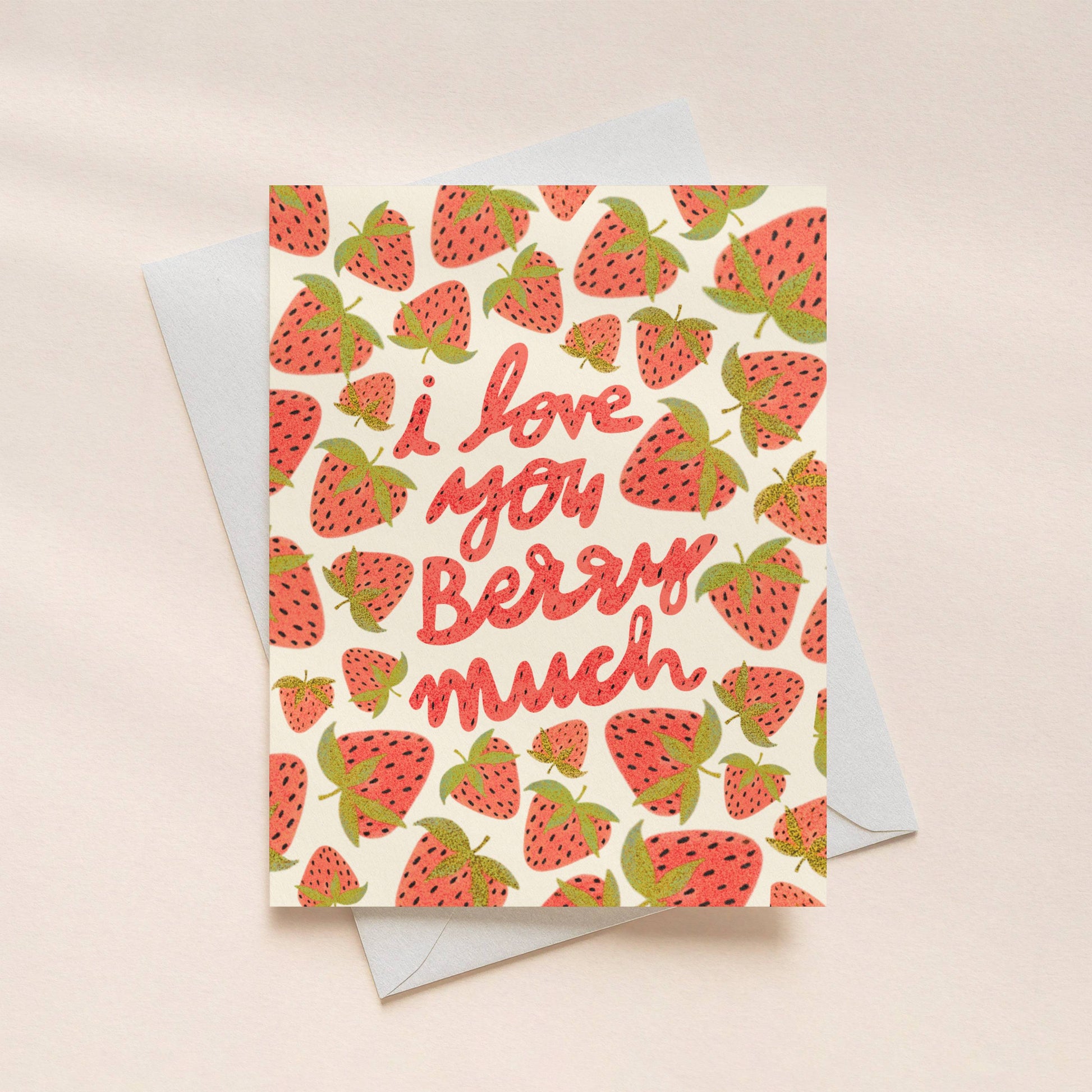 Greeting card with strawberry pattern and 'I love you berry much' text on a beige background