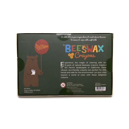 Box of beeswax crayons with a bear illustration and product details on a white background